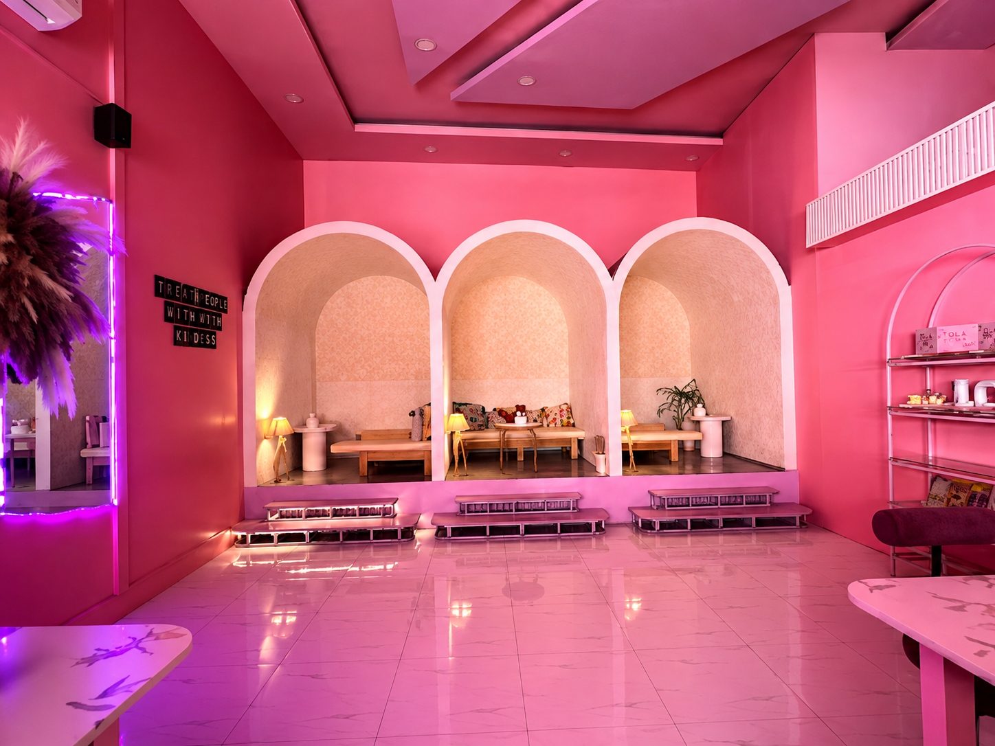 Pink arched interior seating at The Chiya Spot Boudha
