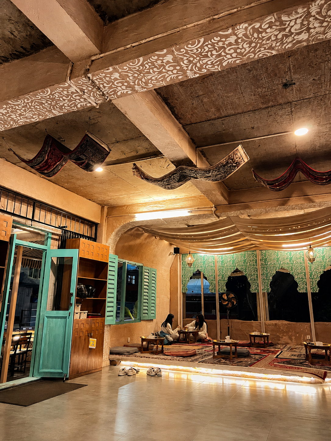 Warm turquoise and clay interior at The Chiya Spot Golfutar