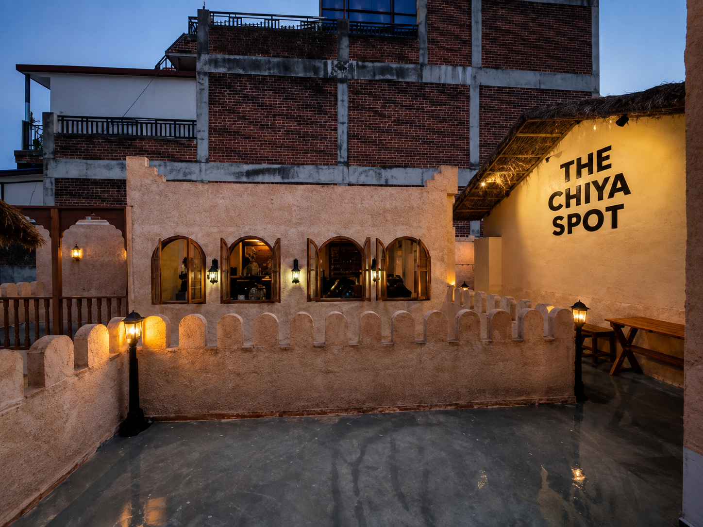 The Chiya Spot courtyard and illuminated logo wall in Putalisadak